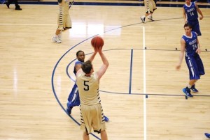 Brian Heinle shoots a three pointer on the night he earns his 1,000 career point