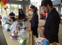 Tara Ritenour, junior psychology major, and Tyler Lookabaugh, junior psychology major, put tickets into the prize baskets